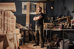 Portrait of mid adult man in carpenter workshop