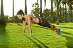 Mid adult woman doing plank exercise