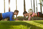 Man and woman doing plank exercise