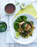 Plate of Hanoi grilled fish with lettuce and herb garnish