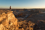 Man on cliff, Valle de la Luna (Valley of the Moon), Atacama Desert, El Norte Grande, Chile