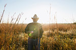 Portrait of senior male farmer in remote field, Plattsburg, Missouri, USA