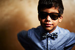 Boy wearing sunglasses and bow tie