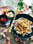 Still life with bowl of Japanese chicken katsu with side dishes