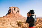 Mid adult woman photographing Monument Valley, Utah, USA