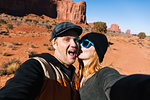 Couple photographing themselves at Monument Valley, Utah, USA
