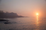 View of coastline and mist over sea at sunrise, Gloucester, Massachusetts, USA