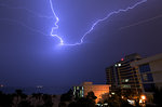 Lightning sparks over the hotels and Atlantic Ocean at Fort Lauderdale, Florida, USA