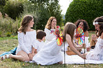 Female friends and family having picnic in garden