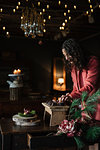 Young woman at rustic table preparing food