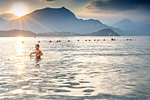 Boy wading in sea