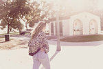 Young woman crossing street