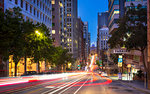 Car trail lights on Bush Street, Oakland Bay Bridge in the background, San Francisco, California, United States of America, North America