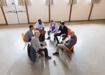 Men talking in group therapy circle