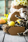 Easter eggs on wood. Colorful Easter holiday concept with  eggs in wisker basket in nature