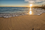 Beautiful sunrise over the sea  with slow shutter and waves flowing out