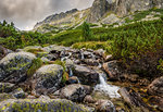 Mountain Landscape with a Creek and Rocks in Foreground on Cloudy Day. Mlynicka Valley, High Tatra, Slovakia.