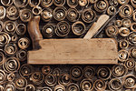 Old wood planer and spiral wood shavings: carpentry, woodworking and craftsmanship concept