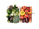 Fresh tasty colorful vegetables in wooden crates on white background