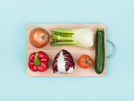 Fresh healthy vegetables on a wooden chopping board, food preparation and healthy eating concept