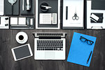 Corporate business office desktop with laptop, tablet and office accessories, flat lay