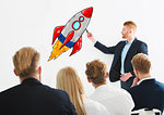 Businessman drawing a fast rocket during a training meeting. Concept of business improvement and enterprise startup