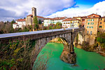 Historic italian landmarks in Cividale del Friuli, Devil's Bridge over green Natisone river, Friuli-Venezia Giulia region of Italy