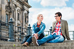 tourists, woman and man, enjoying the view from bridge at the Museum Island in Berlin