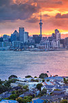 Cityscape image of Auckland skyline, New Zealand during sunset with the Davenport in the foreground.
