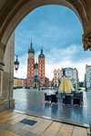 market square in the center of the city of Krakow. Shopping arcade and the Church of St. Mary in the square
