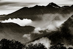 Pyrenees mountain range with mist from Superbagneres Ski Resort, Bagneres-de-Luchon in the Occitanie Region, France