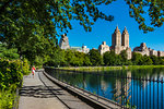 Walkway along the Central Park Reservoir with the San Remo Apartments in the background, New York City, New York, USA