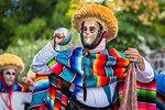 Indigenous tribal dancer wearing mask at a St Michael Archangel Festival parade in San Miguel de Allende, Mexico