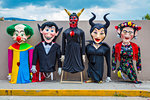 Row of mohiganga puppets at a St Michael Archangel Festival parade in San Miguel de Allende, Mexico