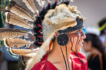 Close-up portrait of an indigenous tribal dancer at a St Michael Archangel Festival parade in San Miguel de Allende, Mexico