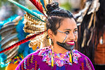 Close-up of a female indigenous tribal dancer at a St Michael Archangel Festival parade in San Miguel de Allende, Mexico