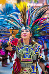 Close-up of a female indigenous tribal dancer holding chalice at a St Michael Archangel Festival parade in San Miguel de Allende, Mexico