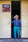 Senior Mexican man standing in doorway in Uriangato, Guanajuato, Mexico