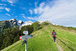 Hiker on footpath, Motta di Olano, Valgerola, Valtellina, Sondrio province, Lombardy, Italy, Europe