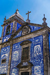 Facade of Chapel of Souls, covered with azulejo blue and white painted ceramic tiles, Capela das Almas Church, Porto, Portugal, Europe