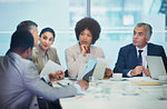 Attentive business people listening in conference room meeting