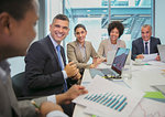 Smiling business people in conference room meeting