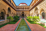 Patio de las Doncellas, a decorated courtyard and pool in typical Mudejar architecture, Real Alcazar, UNESCO World Heritage Site, Seville, Andalusia, Spain, Europe