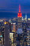 Lower Manhattan skyline from Top of The Rock, Empire State Building at night, New York, United States of America, North America