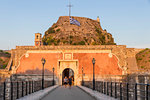 Entrance gate with the old fortress of Corfu Town (Kerkyra) in the background at sunset, Corfu, Greek Islands, Greece, Europe