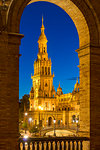 Illuminated Northern Tower at Plaza de Espana during dusk, Seville, Andalusia, Spain, Europe