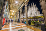 View of Duomo di Milano illuminated at dusk from Galleria Vittorio Emanuele II in Piazza Del Duomo at dusk, Milan, Lombardy, Italy, Europe