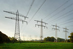 Field landscape with power lines near coal fired power station, Netherlands