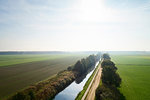 Canal cutting through field landscape, elevated view, Netherlands