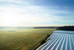 Field landscape with plant nursery greenhouse roof at sunrise, elevated view, Netherlands